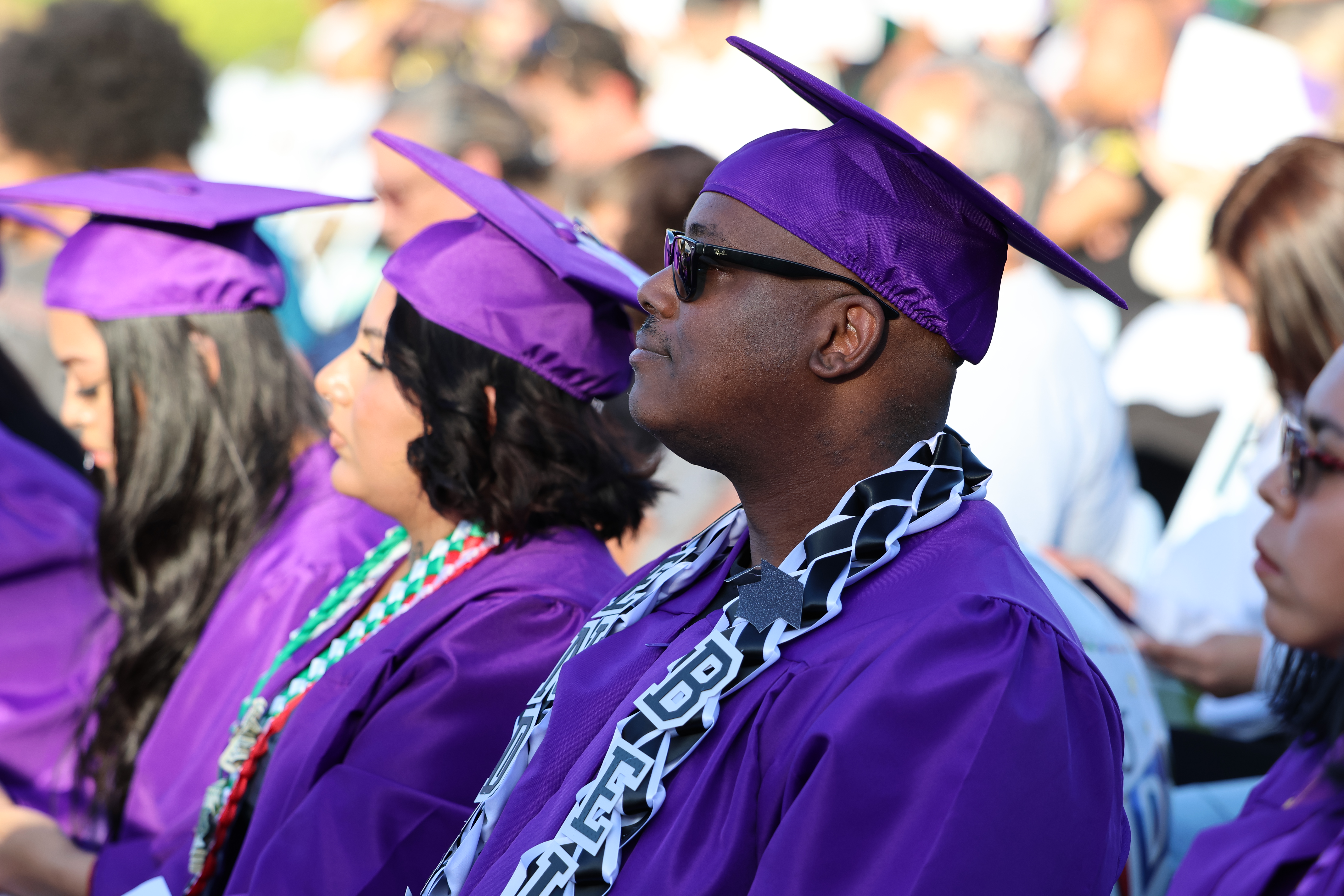 graduate hugging a person